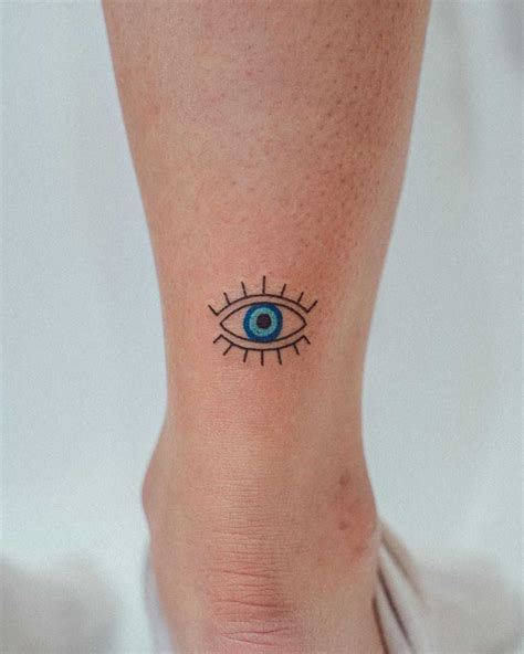 Evil eye tattoo by tattooist Bongkee - Tattoogrid.net