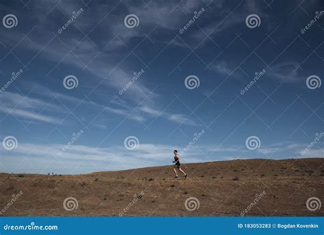 Runner Athlete Running In Desert Fit Man Training Cardio Outdoors