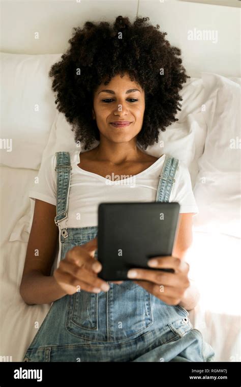 Woman Lying In Bed Reading Hi Res Stock Photography And Images Alamy