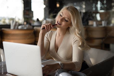 Sexy Woman Using Laptop Pc Sitting In Cafe Stock Photo Adobe Stock