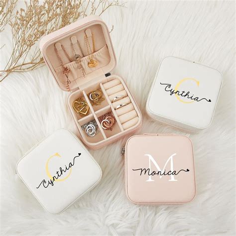 Three Personalized Jewelry Boxes Sitting On Top Of A White Furnishing