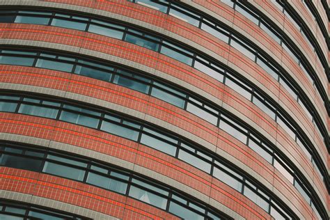 X Wallpaper Brown And Glass Circular Building Peakpx