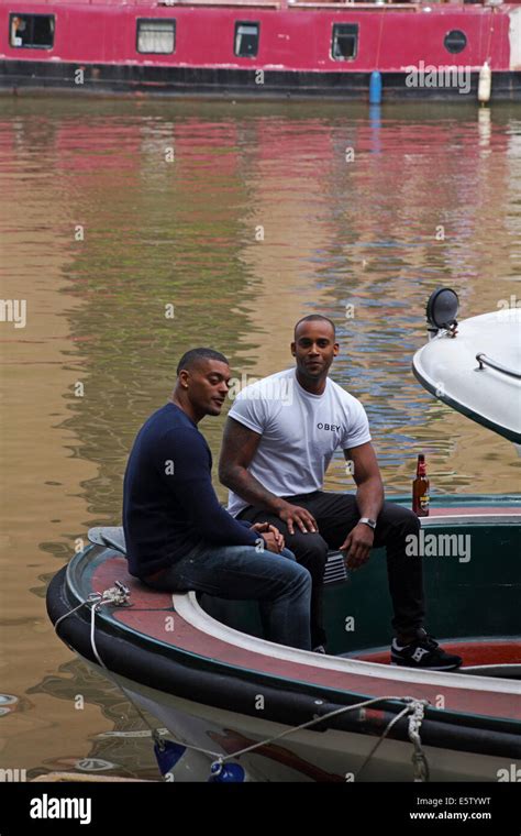 Two Men Sat At The Back Of Boat At River Avon Bristol In May Stock