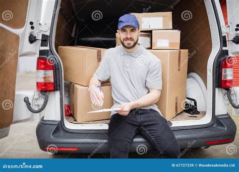 Delivery Man Writing On Clipboard Stock Image Image Of Portrait