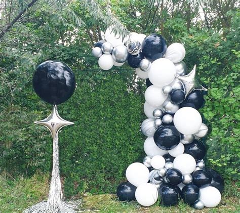 a number one made out of black and white balloons