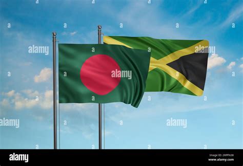 Jamaica And Bangladesh Flag Waving Together In The Wind On Blue Sky