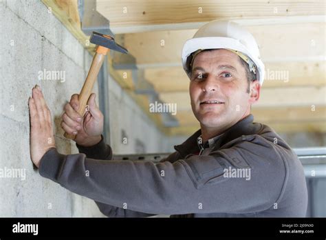 Male Construction Worker Using A Hammer Stock Photo Alamy