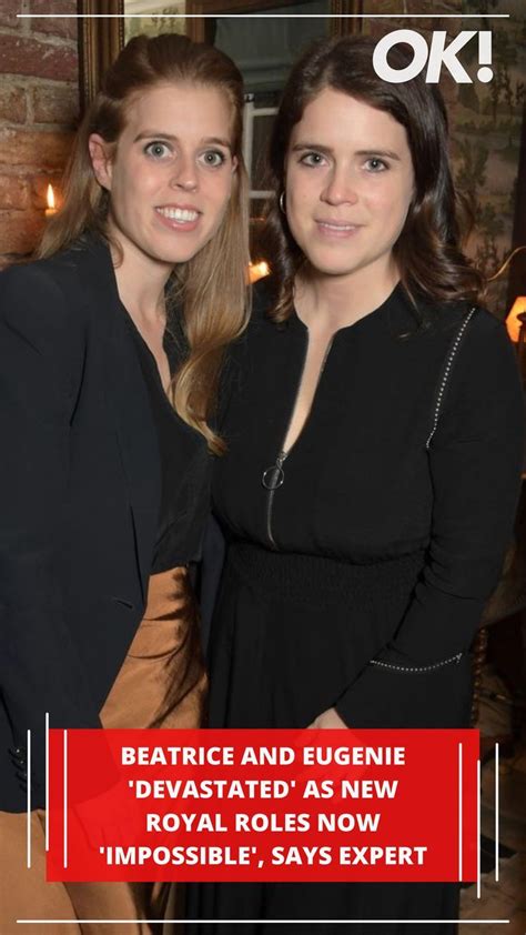 two women standing next to each other in front of a brick wall with the ...