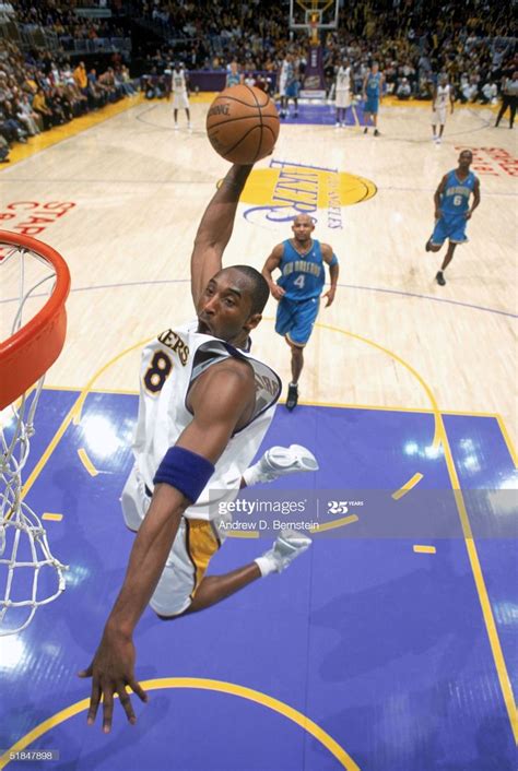 Kobe Bryant of the Los Angeles Lakers dunks during the game against ...