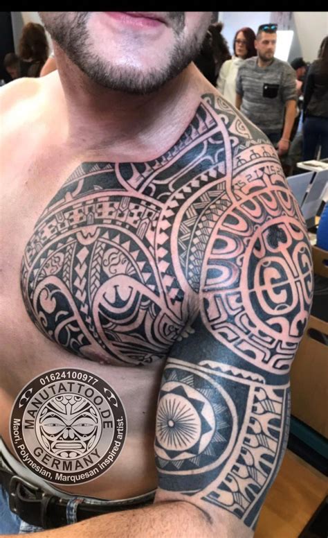 Freehand Marquesan Inspired Tattoo On Chest And Half Sleeve