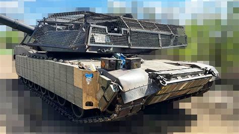 Ukrainian M1 Abrams Tanks Get Elaborate 'Cope Cages,' Soviet Explosive Reactive Armor