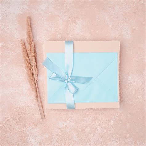 Free Photo | Wedding invitation with blue envelope