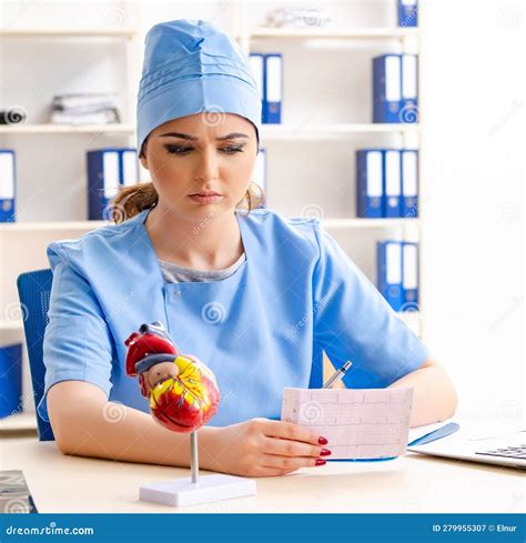 Young Female Doctor Cardiologist Sitting at the Hospital Stock Image