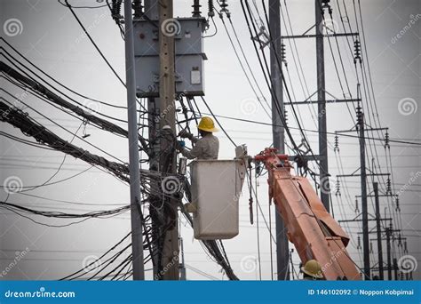 Electricians Wiring And Repairing Wires Workers In Buckets Attaching