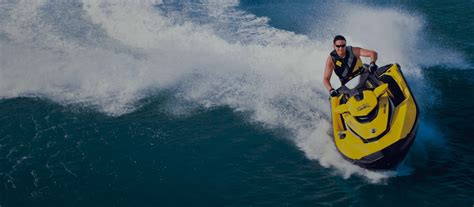 Download Vibrant Yellow Jet Ski Riding The Waves Wallpaper