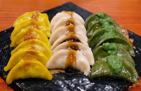 Three Gyoza On Black Plate Stock Image Image Of Closeup 151713023