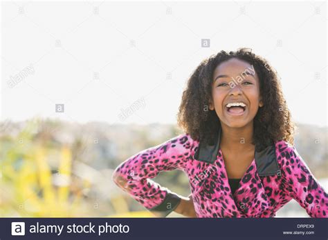 Portrait of smiling girl outdoors Stock Photo - Alamy