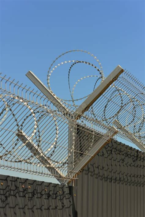 Fence with razor wire stock image. Image of architecture - 116282609