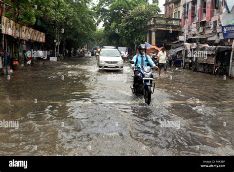 Kolkata India 26th June 2018 Commuters Cross A Water Log Street