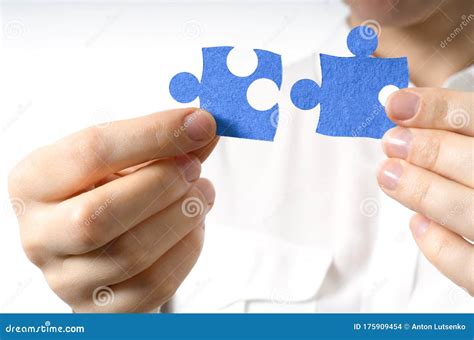 Female Hands Holding Two Blue Puzzle Pieces Stock Photo Image Of Hand