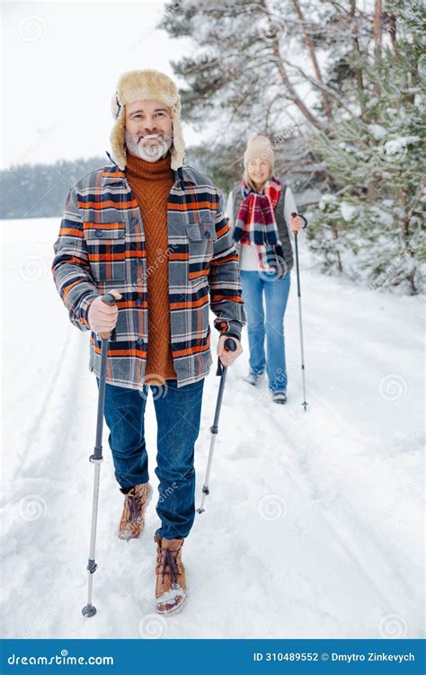 Couple On A Walk With Scandinavian Sticks Stock Photo Image Of