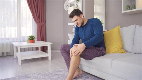 young man  aching leg suffers  disability man  pain