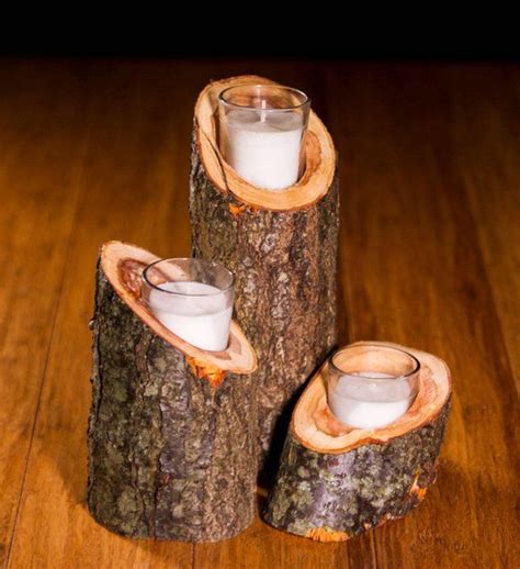 Two Candle Holders Made Out Of Tree Trunks