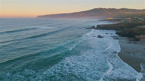 Aerial View Amazing Ocean Rolling On Coastal Rocks At Sunrise Foamy