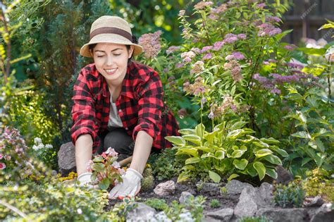 Premium Photo | Woman gardener planting flowers