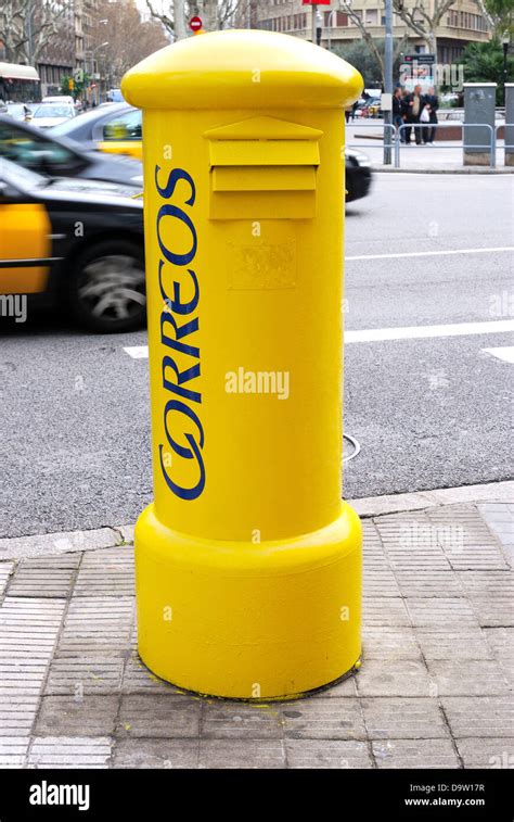 Yellow Mail Post Box By Busy Street In Barcelona Catalonia Spain