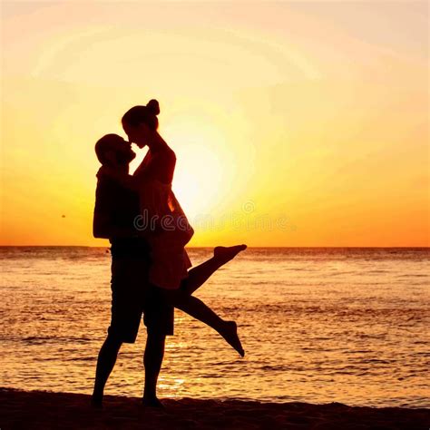 Romantic Couple on the Beach at Colorful Sunset on Background Stock ...