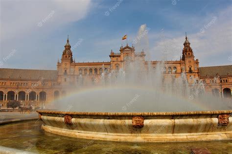 Premium Photo | A fountain in the plaza de espana with a rainbow in the ...