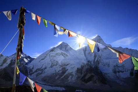 everest prayer flags Sun rising over Mt Everest. Image by Cathy Finch ...