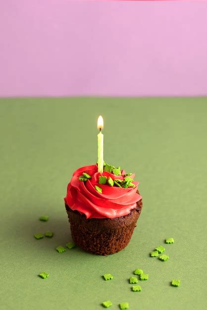 Free Photo | Colorful delicious cupcake with frosting on top