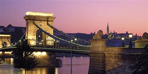 The Bridge Is Lit Up At Night Time