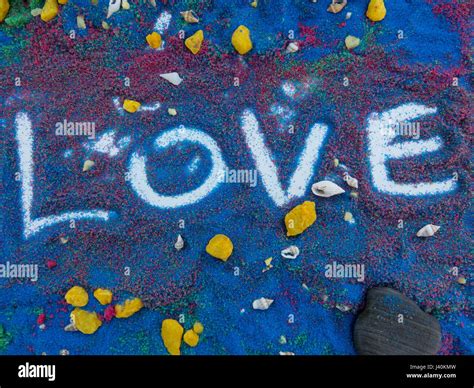 love written in colors sand Stock Photo - Alamy