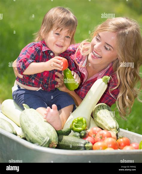 happy family in the garden Stock Photo - Alamy