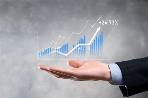 Businessman Holding Graph Growth And Increase Of Chart Positive