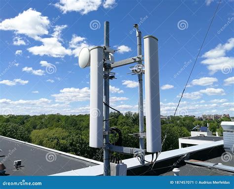 Gsm Base Station Antenna In Front Of Blue Cloudy Sky Stock Image