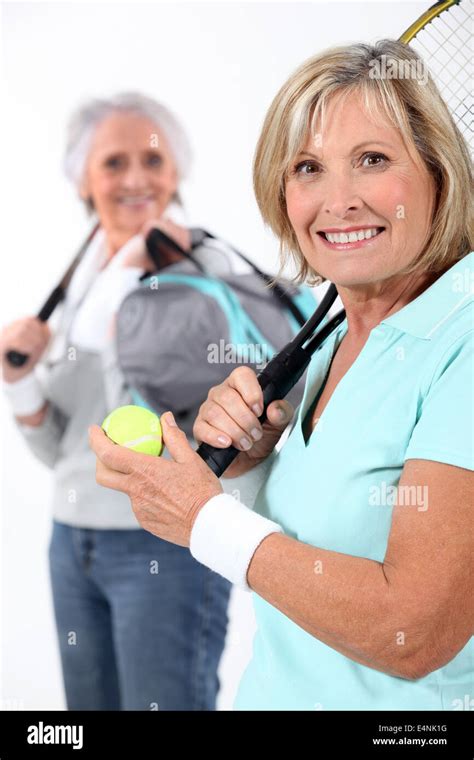 Mature Women With Tennis Rackets Stock Photo Alamy