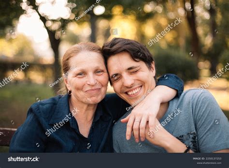 Happy Mature Mother Hugging Smiling Adult Stock Photo