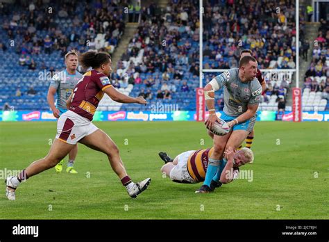 Cameron Smith 17 Of Leeds Rhinos Manages To Pass The Ball Before Been