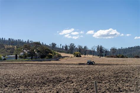 Premium Photo Tractor Plowing A Field In A Dry Hot Summer Farming Landscape Australia