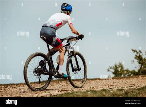 Male Athlete On Mountainbike Riding Gravel Trail Stock Photo Alamy