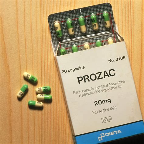 Prozac Pack With Pills On Wooden Surface Photograph By Damien Lovegrove Fine Art America