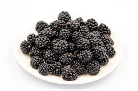 Premium Photo | Black mulberry isolated on white background Fresh and juicy black mulberry on ...