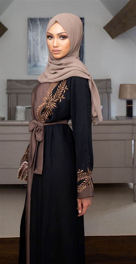 A Beautiful Classic Black Abaya With Contrasting Gold Floral Embroidery