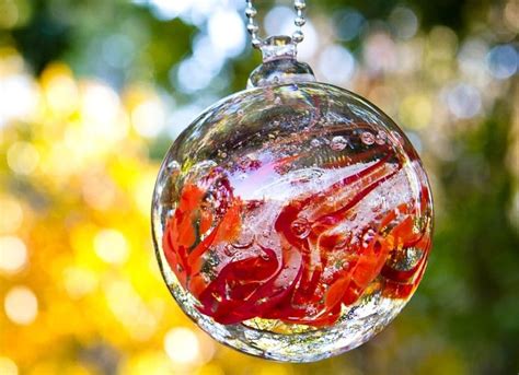 Red Ball Hanging From Tree Cremation Glass Cremation Glass Art Urn