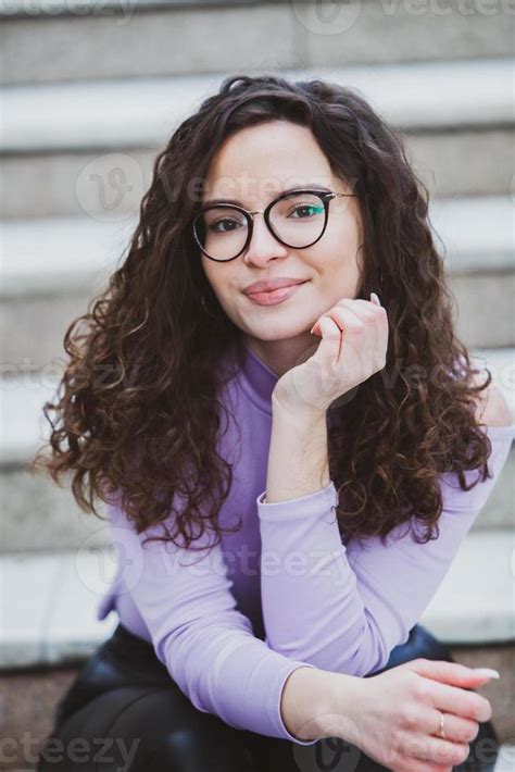 Beautiful Young Woman With Brunette Curly Hair Portrait In Eye Glasses