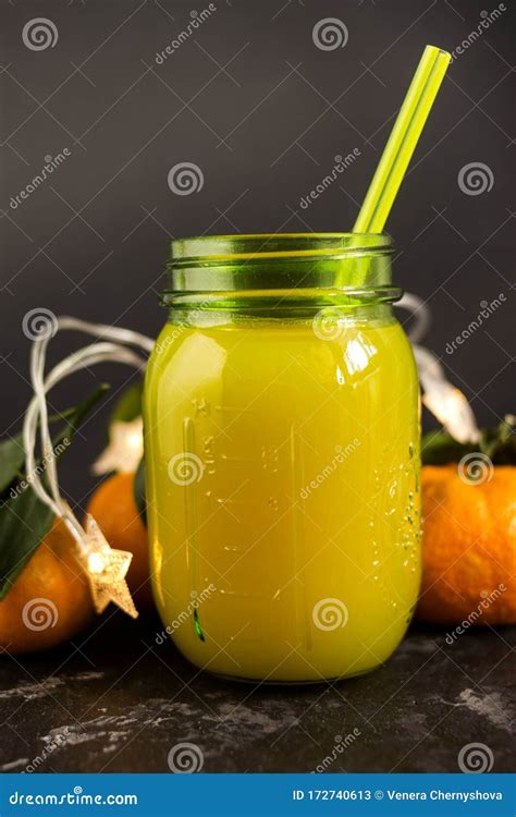 Freshly Squeezed Orange Juice In A Mason Jar And Fresh Oranges Fruit